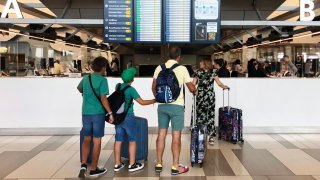 Travelers at LaGuardia Airport in New York on June 30, 2022.