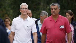 Apple CEO Tim Cook, left, and Eddy Cue, Apple’s senior vice president of services attend the Allen & Co. Media and Technology Conference in Sun Valley, Idaho, on July 10, 2019.