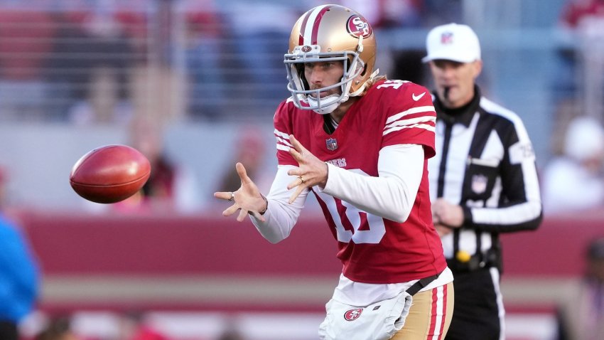 Punter about to kick a football