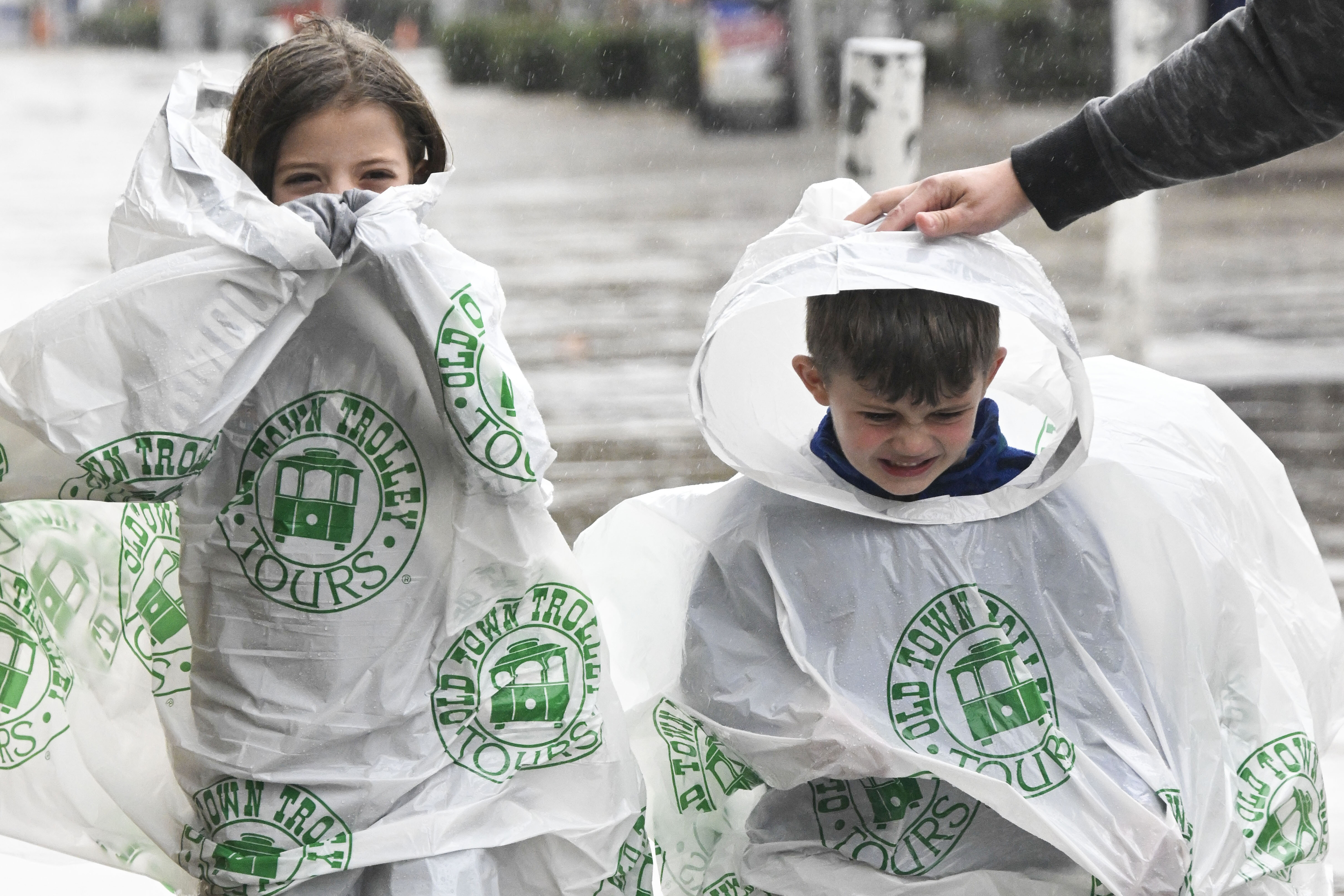 Raegan, left, and Judah Mccracken walk along the Embarcadero, Thursday, Feb. 1, 2024, in San Diego.