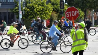 People ride bicycles in car-free streets during a CicLAvia event in Culver City on March 3, 2019. – CicLAvia is a non-profit organization that hosts events where people can bike, walk, skate and stroll on car-free streets. (Photo by Chris Delmas / AFP)        (Photo credit should read CHRIS DELMAS/AFP via Getty Images)