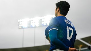 Los Angeles Dodgers designated hitter Shohei Ohtani (17) stands as the national anthem plays before a spring training baseball game against the Los Angeles Angels in Los Angeles, Sunday, March 24, 2024.