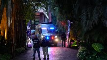 Federal agents stand at the entrance to a property belonging to rapper Sean "Diddy" Combs, Monday, March 25, 2024.