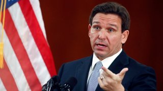 FILE - Florida Gov. Ron DeSantis answers questions from the media, March 7, 2023, at the state Capitol in Tallahassee, Fla.