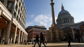 City workers in Paternoster Square, where the headquarters of the London Stock Exchange is based, in the City of London, UK.