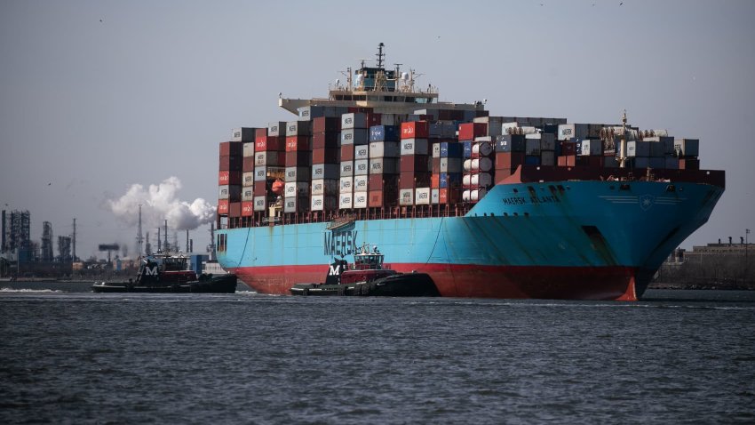 Tugboats guide the Maersk Atlanta container ship at the Port of Newark in Newark, New Jersey, US, on Saturday, March 30, 2024. 