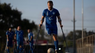 The soccer player of Israel Amputee Football Team, Ben Binyamin controls the ball during a practice session in Ramat Gan