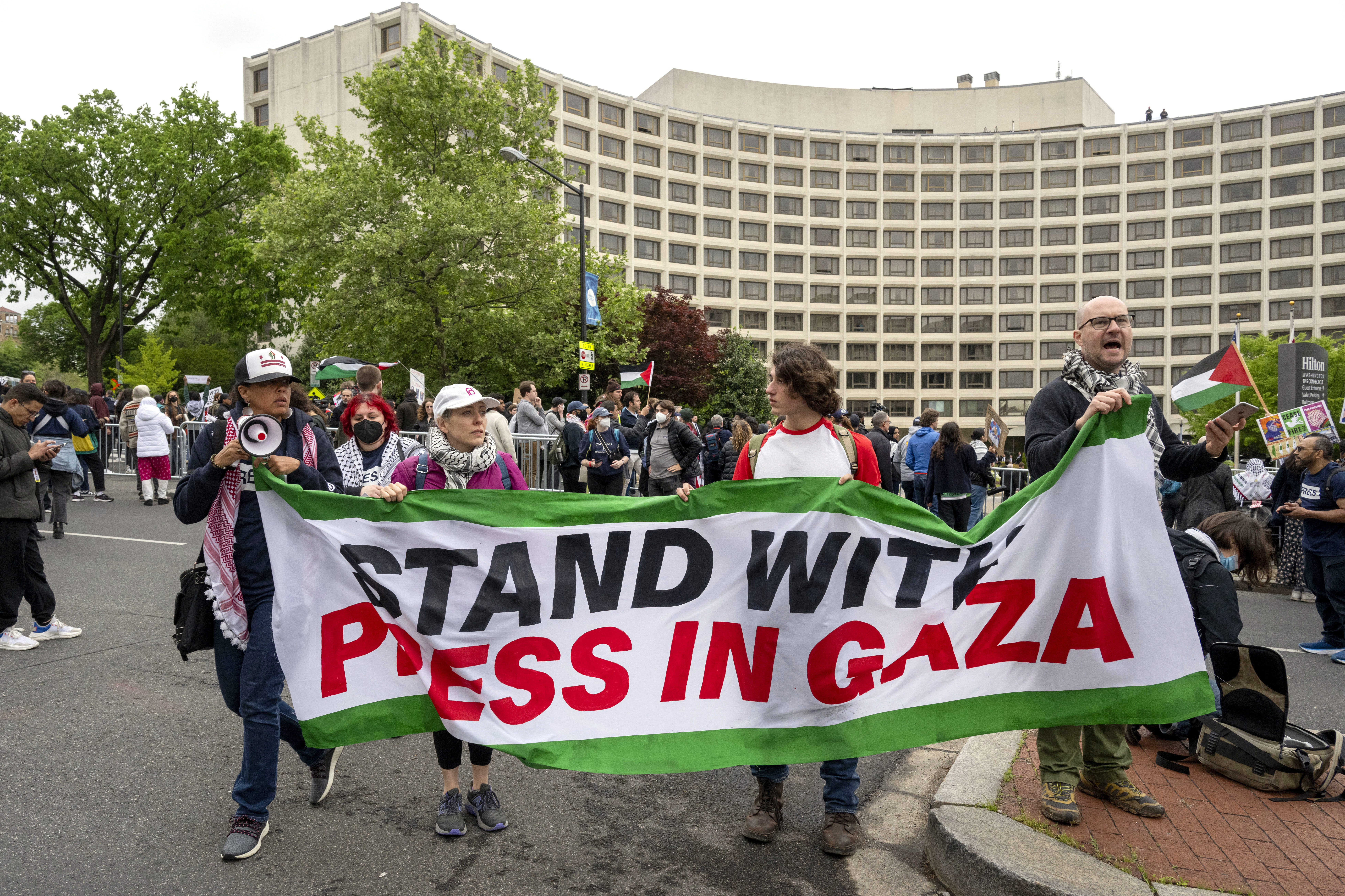 Demonstrators protest the Israel-Hamas war outside the Washington Hilton hotel before the start of the White House Correspondents' Association Dinner 