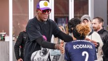 WASHINGTON, DC - NOVEMBER 7: Washington Spirit forward Trinity Rodman (2) with her father basketball legend Dennis Rodman after a game between North Carolina Courage and Washington Spirit at Audi Field on November 7, 2021 in Washington, DC. (Photo by Tony Quinn/ISI Photos/Getty Images)