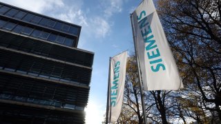 15 November 2023, Bavaria, Munich: Flags with the word “Siemens” in front of the company’s headquarters.