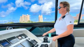 Captain Kelly J. Gordon, driving a superyacht.