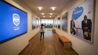 An employee walks through a hall inside the Salesforce.com Inc. office at the new Salesforce Tower in San Francisco, California, U.S., on Tuesday, May 22, 2018. The building, the tallest office tower west of the Mississippi river, opened with a ceremony crowded with local officials on Tuesday, representing the indelible mark San Francisco’s largest private employer has made on the city. Photographer: David Paul Morris/Bloomberg via Getty Images