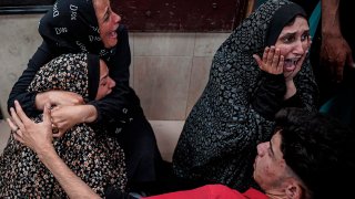 Palestinians mourn their relative killed in the Israeli bombardment of the Gaza Strip, at Al Aqsa Hospital in Deir al Balah, Gaza Strip, early Sunday, May 12, 2024.