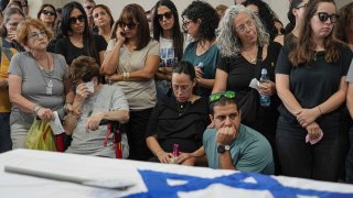 Mourners attend the funeral of Michel Nisenbaum