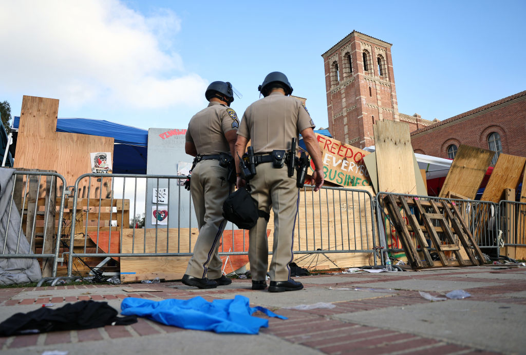 California Highway Patrol (CHP) officers patrol at a pro-Palestinian encampment at the University of California, Los Angeles (UCLA) campus, on May 1, 2024 in Los Angeles, California.