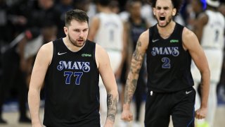Luka Doncic #77 and Dereck Lively II #2 of the Dallas Mavericks celebrate after defeating the Minnesota Timberwolves in Game Two