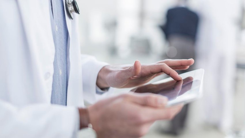 Doctor looking at a tablet