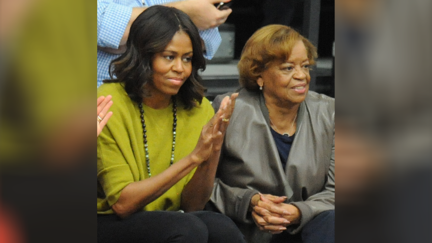 First Lady Michelle Obama (L) and Marian Robinson (R) watch a women’s college basketball game between the Princeton Tigers and the American University Eagles at Bender Arena on November 23, 2014 in Washington, DC. President Barack Obama’s niece, Leslie Robinson, was playing for Princeton.