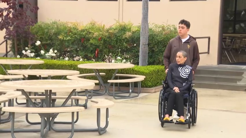 Preston Guinto and his mother, Wendy Carrera, stroll through St. Francis High School in La Cañada during an interview with NBC4.