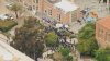 Demonstrators climb onto rooftop of building at UCLA protest encampment
