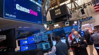 Traders walk the floor during morning trading at the New York Stock Exchange (NYSE) on May 14, 2024 in New York City. 