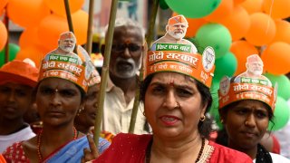 Bharatiya Janata Party supporters wearing a hat with Narendra Modi’s face during a nomination filing rally by in Kolkata, India on May 10, 2024. 