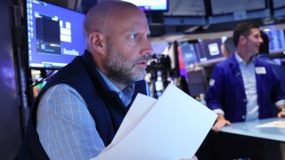 Traders work on the floor of the New York Stock Exchange during morning trading on June 12, 2024 in New York City. 