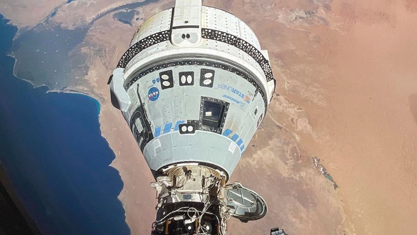 This photo provided by NASA shows the Starliner spacecraft docked to the Harmony module of the International Space Station, orbiting 262 miles above Egypt's Mediterranean coast, on June 13, 2024.