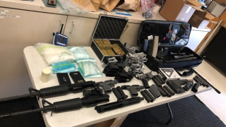 The DOJ said agents seized two pounds of methamphetamine and a cache of ghost guns and ammunition on June 30, 2021.