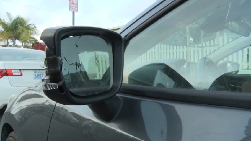 The smashed side mirror of a car in Torrance is seen on Wednesday, June 19, 2024.