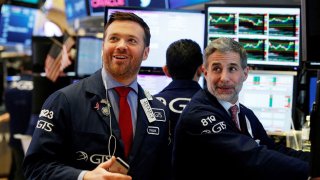 Traders work on the floor of the New York Stock Exchange.