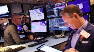 Traders work on the floor of the New York Stock Exchange during morning trading on January 04, 2023 in New York City. 