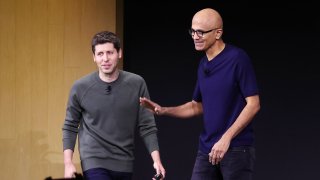 Microsoft CEO Satya Nadella, right, greets OpenAI CEO Sam Altman during the OpenAI DevDay event in San Francisco on Nov. 6, 2023.