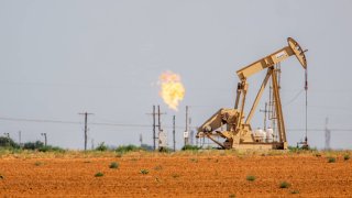 An oil pumpjack is shown in a field in Stanton, Texas, on June 27, 2024.