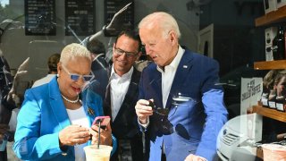 US President Joe Biden (R) visits a coffee shop with Pennsylvania Governor Josh Shapiro (C) and Harrisburg Mayor Wanda Williams (L) in Harrisburg, Pennsylvania, on July 7, 2024. Biden is back out on the campaign trail Sunday, desperate to salvage his re-election bid as senior Democrats meet to discuss growing calls that he quit the White House race. The 81-year-old Democrat kicks off a grueling week with two campaign rallies in the battleground state of Pennsylvania, before hosting the NATO leaders’ summit in Washington.