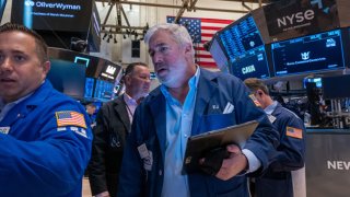 Traders work on the floor of the New York Stock Exchange (NYSE) on July 11, 2024 in New York City.