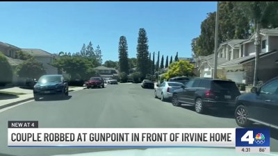 Irvine couple robbed at gunpoint in front of home