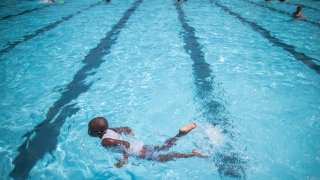 Children cool off at the Hamilton Fish pool