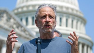 FILE – Entertainer and activist Jon Stewart speaks at the Capitol in Washington, May 26, 2021. Stewart is pressing the Biden administration to fix a loophole in a massive veterans aid bill that has left out some of the very first troops who responded after the Sept. 11 attacks. They got sick from staying at at Karshi-Khanabad, Uzbekistan, or K2, a base contaminated with enriched uranium.