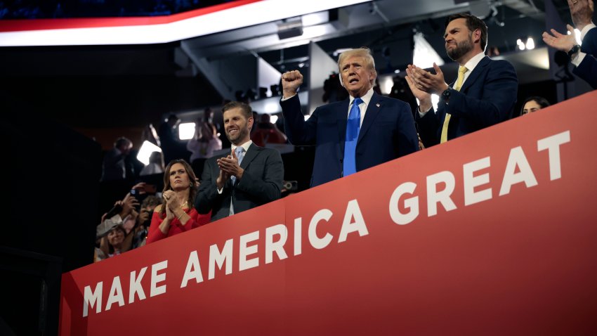 Sarah Huckabee Sanders, governor of Arkansas, from left, Eric Trump, executive vice president of Trump Organization Inc., former US President Donald Trump, and Senator JD Vance, a Republican from Ohio and Republican vice-presidential nominee, during the Republican National Convention (RNC) at the Fiserv Forum in Milwaukee, Wisconsin, US, on Tuesday, July 16, 2024. Former President Donald Trump tapped JD Vance as his running mate, elevating to the Republican presidential ticket a venture capitalist-turned-senator whose embrace of populist politics garnered national attention and made him a rising star in the party. Photographer: Hannah Beier/Bloomberg via Getty Images