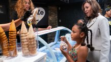 WASHINGTON, DC - JULY 19: U.S. Vice President Kamala Harris and her two grand nieces order from Tyra Banks at her new shop, Smize Dream Ice Cream, on July 19, 2024 in Washington, DC. Harris made the stop as pressure continues to increase on President Joe Biden to end his presidential campaign. (Photo by Nathan Howard/Getty Images)