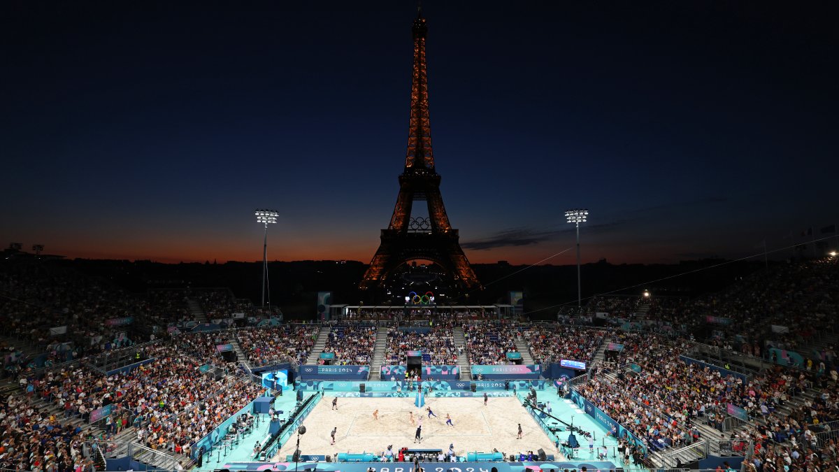 Beach volleyball at Eiffel Tower Stadium draws crowds looking for the