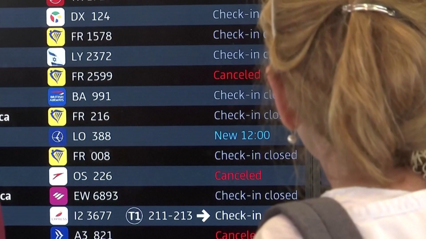 Person looking at screen with flight listings