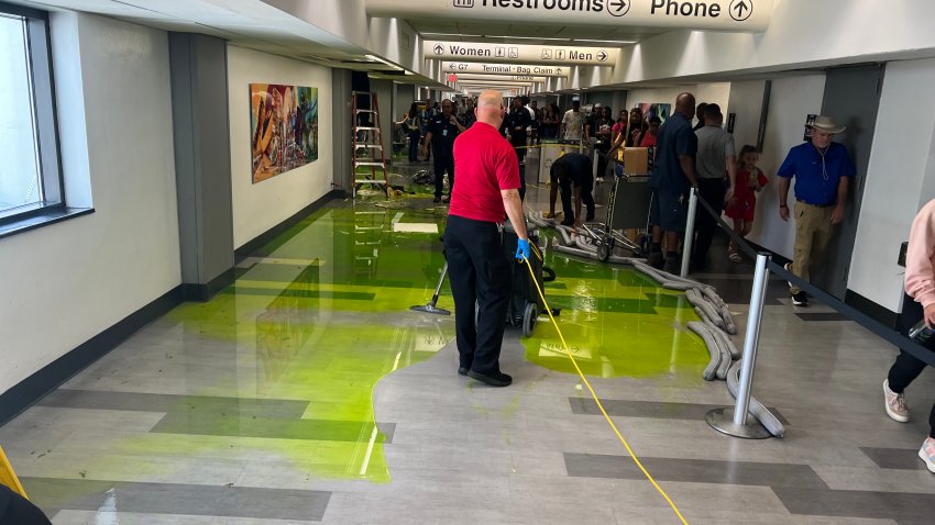 Video shows how green fluid poured onto the floor of Miami International Airport on July Fourth, covering the tile with fluorescent puddles.