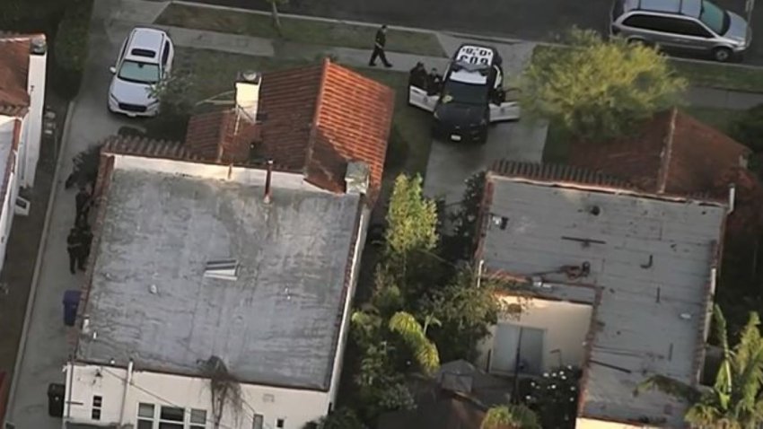 Police at the scene of a home break-in Monday July 29, 2024 in Mid City.