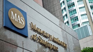 Signage for the Monetary Authority of Singapore (MAS) is displayed outside the central bank’s headquarters in Singapore.