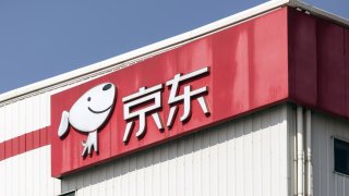 Signage at JD.com’s warehouse in Shanghai, China, on Mar. 9, 2022. The U.S. Securities and Exchange Commission on Wednesday added over 80 firms to its list of entities facing possible expulsion from American exchanges, which include China’s JD.com, Pinduoduo, Bilibili, and NetEase.