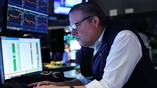 Traders work on the floor of the New York Stock Exchange during morning trading on June 12, 2024 in New York City. 