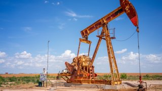 An oil pump jack is shown in a field on June 27, 2024 in Stanton, Texas. 