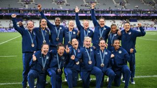 U.S. players celebrate with their bronze medals during the victory ceremony following the women’s gold medal rugby sevens match during the Paris 2024 Olympic Games.